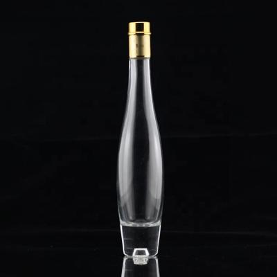 China 750ml Heavy-based Clear Glass Alcohol Bottle with Golden Metal Cap in Bulk for sale