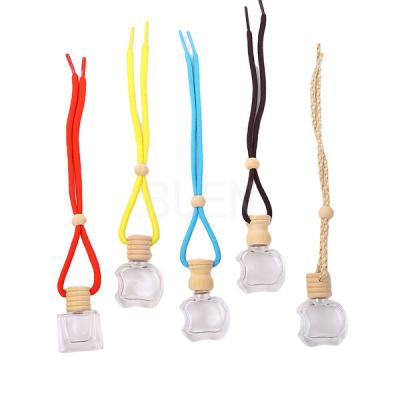 China Car Hanging Wooden Cap Glass Aroma Diffuser Bottle Round Car Diffuser Perfume Bottle for sale