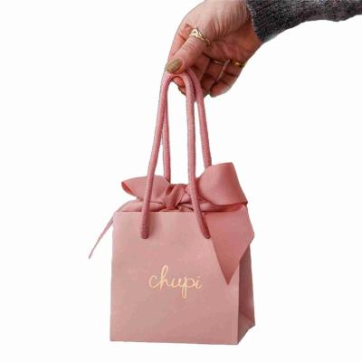 China Recycled Small Pink Cardboard Printed Paper Gift Bags Ribbon Handle Bags for sale