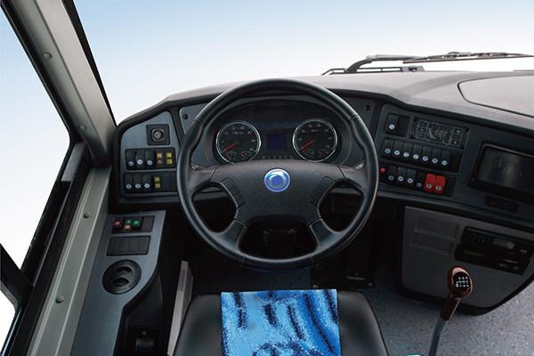 Close-up of passenger seats with reclining features and individual controls