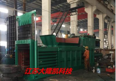 China Horizontal Paper Baler Machine Manual Strapping Conveyor Feeding Material for sale