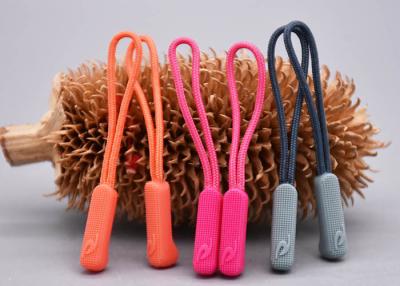 China 3D Embossed Plastic Zipper Puller With Polyester String For Garments for sale