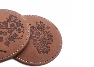China Brown Drink Coasters Set PU Leather Round Glass Coasters Debossed Logo for sale