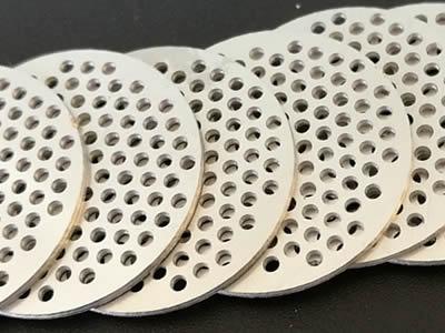 There are eight perforated filter discs with round holes.