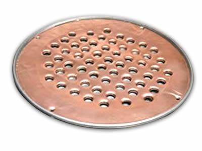 There is a copper perforated filter disc with round holes.