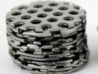 Perforated filter disc with unified, round and micro holes without margin.