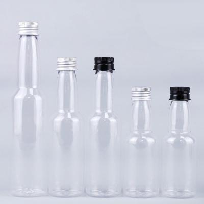 China Venda Quente 50 ml de plástico PET transparente redondo garrafa de bebidas alcoólicas com tampa de alumínio à venda