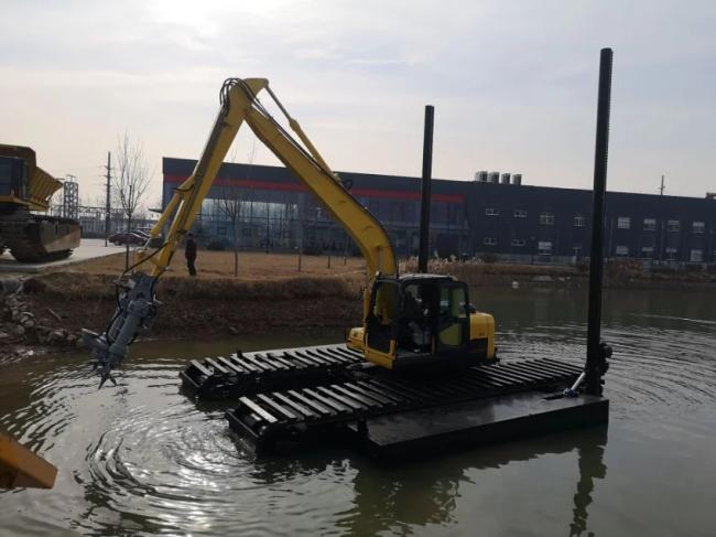 Amphibious excavator working in water
