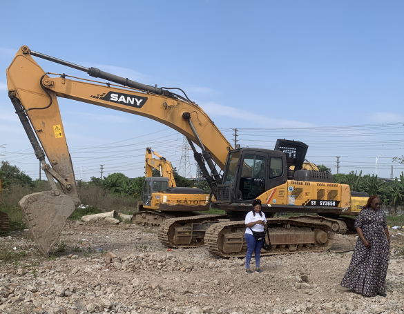 Customers from India inspecting used excavators