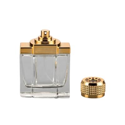 China O pulverizador de perfume vazio do tampão plástico UV engarrafa a cor dourada de vidro do tampão 100ml à venda