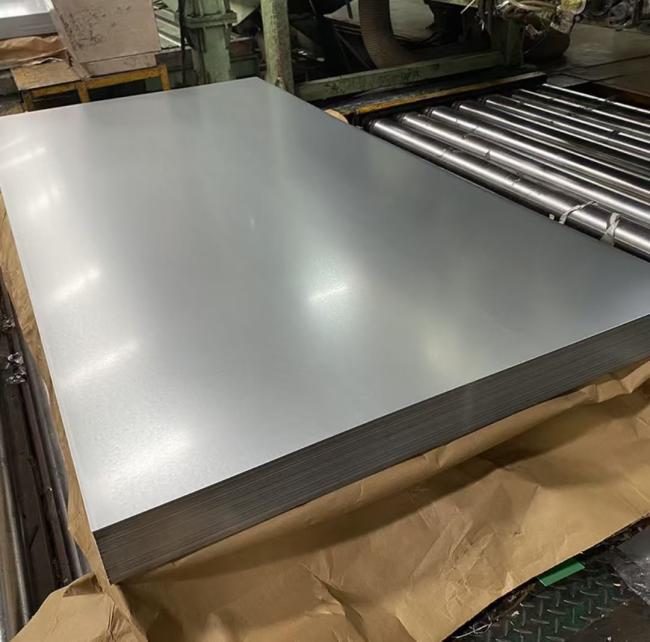 Massive ready stock of hot dip galvanized steel coils (GI) in warehouse and stockyard.