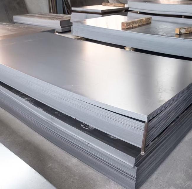 Massive ready stock of hot dip galvanized steel coils (GI) in warehouse and stockyard.