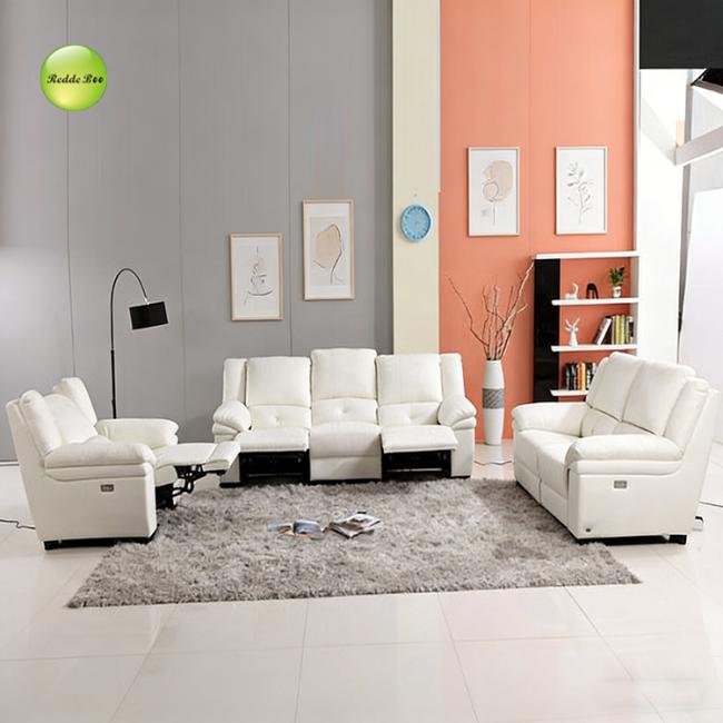 White leather recliner set detail view highlighting built-in storage and cup holders