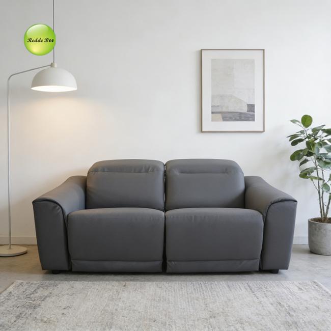 Gray leather recliner in reclined position showing full extension