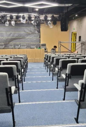 Completed theater seating project in venue setting demonstrating space optimization
