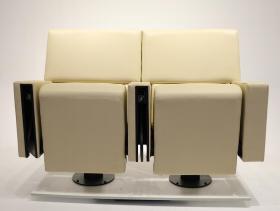 Close-up view of FY962 theater chair showing cup holder and foldable mechanism