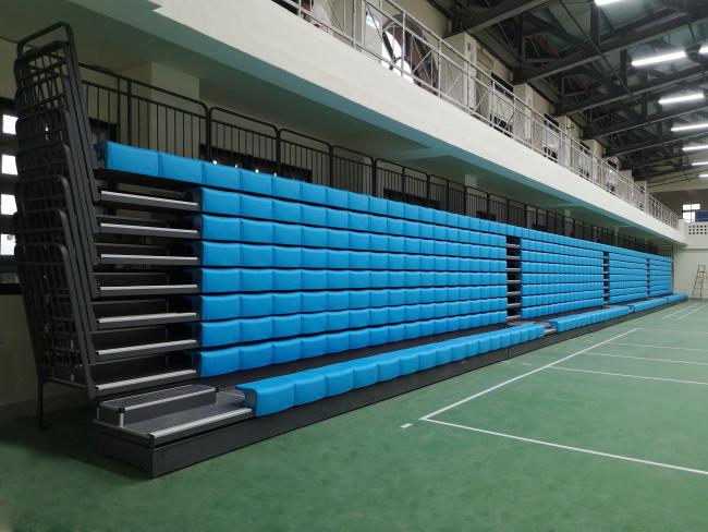 Wall attached retractable bleachers system