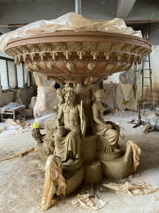 Detailed craftsmanship of bronze fountain