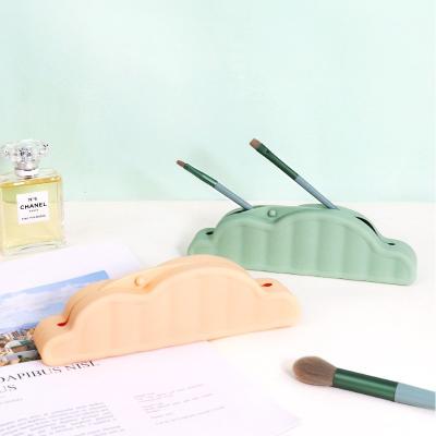 China Tenedor multicolor del bolso del maquillaje del silicón del cepillo portátil para el viaje en venta
