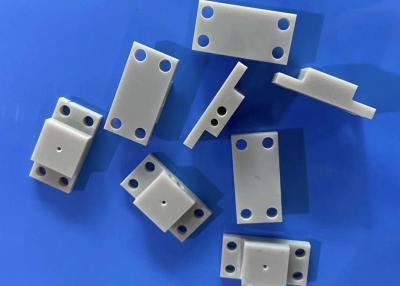 China Alumina Nitride Ceramic Parts 15KV/mm Dielectric Strength 4.5-5.5x10-6/K for sale