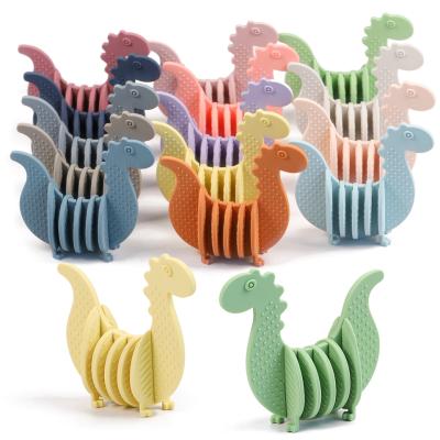 China Blue Silicone Dinosaur Teether Dinosaur Natural Rubber Teether for sale