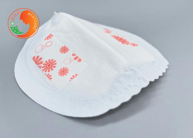 Close-up view of breast milk pad showing material texture and construction