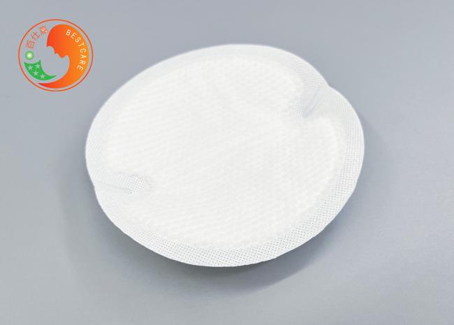 Sanitary disposable breast pad front view showing shell shape design