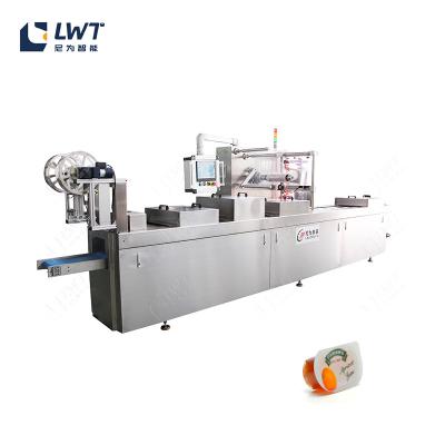 China Máquinas de embalaje de vacío de termoformación de confitura de película de estiramiento continuo Máquina de embalaje de sellador de vacío en venta