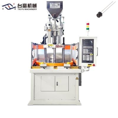 China Máquina de fabricación de transmisores de luz infrarrojos de 35 toneladas Máquina de moldeo por inyección vertical rotativa en venta