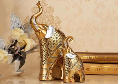 China Estatua animal de la estatuilla del elefante del color oro de los artes de las decoraciones del hogar de la resina en venta
