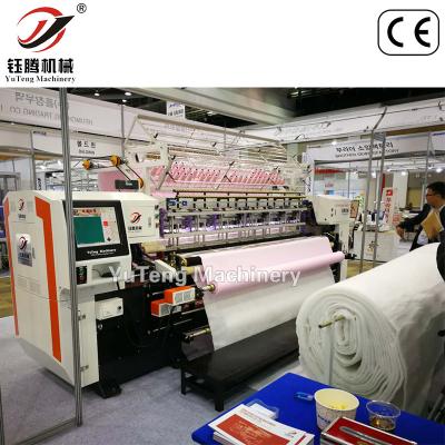 China Máquina de coser con punto de bloqueo con agujas múltiples Fabricante de máquinas de colgar en venta