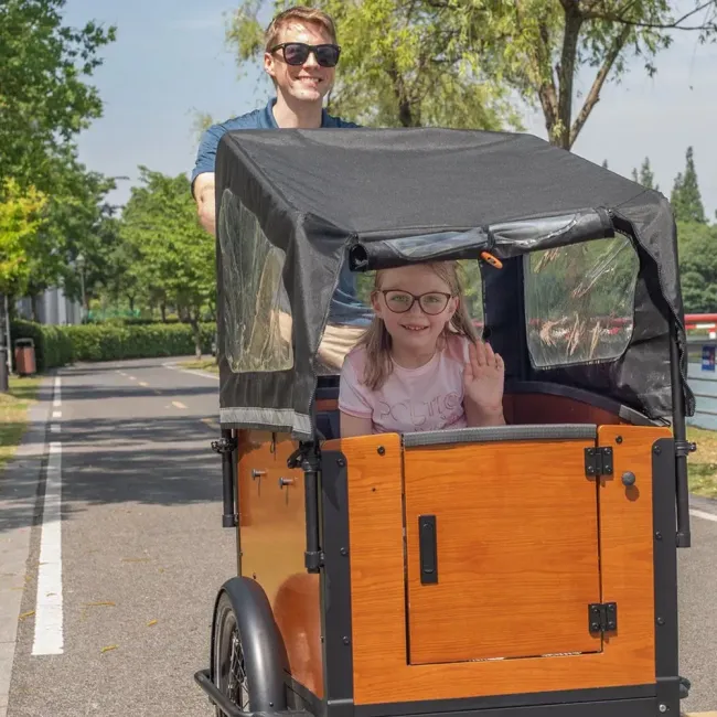 Safety-Equipped Electric Cargo Bicycle with Handrails and Safety Belts