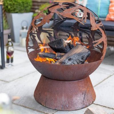China Wood Burning Laser Cut Design Oxidised Corten Steel Swallows Globe Fire Pit for sale