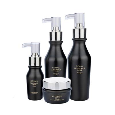 China 50g 50ml 100ml Cosmetic Packaging Bottle Matte Black With Pump Dispenser for sale