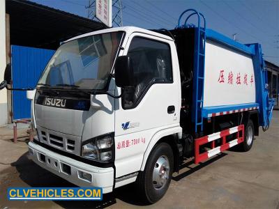 China ISUZU 600P 7CBM camión de basura automático dirección eléctrica elevador hidráulico en venta