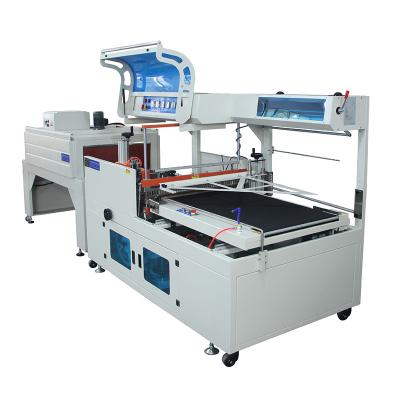 China Labeling Equipment Automatic Stick Tag Heat Shrinking Wrapping Packing Machine for sale