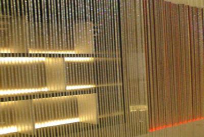 China Spiral Metal Curtain Wall Architectural Wire Mesh Herringbone Bronze Hotel Curtain for sale