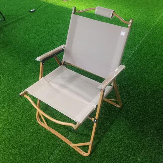 Folding outdoor chair in use during camping