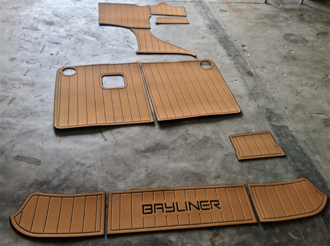 Close-up view of faux teak EVA flooring texture and pattern