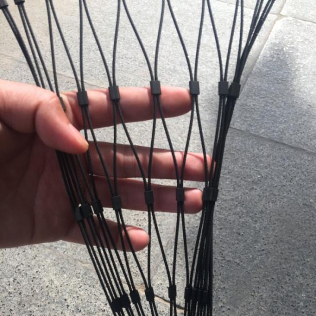 Close-up detail of black oxide stainless steel rope mesh