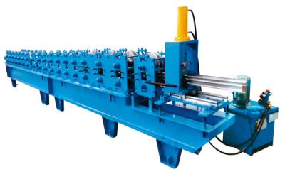 China 12 Stations Fly Saw Cutting Shutter Door Roll Forming Machine Shutter Door Edge Covering for sale