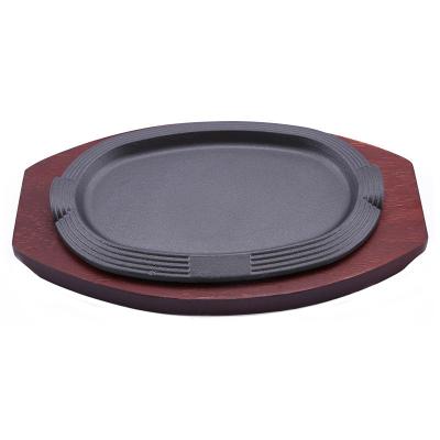 China Oval Sizzler Plate With Wooden Base 27*17cm Cast Iron Sizzling Plate for sale