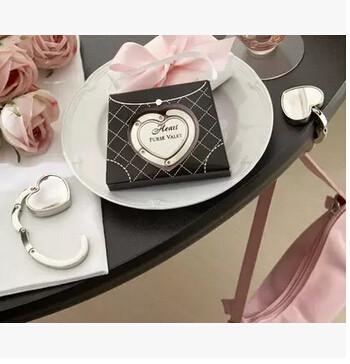 China New creative promotion gift product wedding gift heart crystal bag hanger for sale