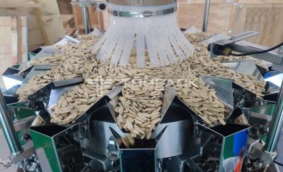 China Vertical Vffs Melon Seeds Weighing Packing Machine Sunflower Seeds Sweet Snacks Bagging Machine for sale
