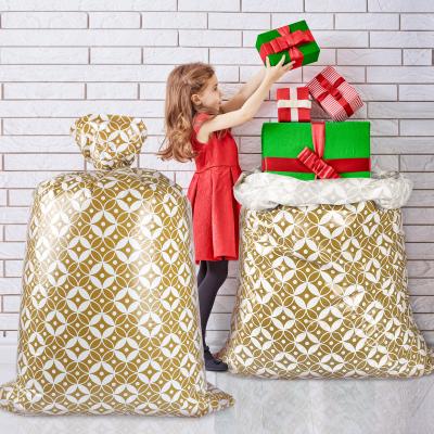 China Custom Gold Pattern 56 Inch Jumbo Plastic Present Bag For Chirstmas for sale