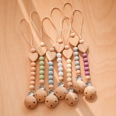 China Silicone Pacifier Chain Clip Wooden Dummy Jacket Holder Clip Medium Caliber for sale