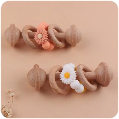 China New Beech Children's Toys Tooth Glue Infant Exercise Hand Grip Rattle Baby Creative  Educational Molar Stick Teething Toys à venda