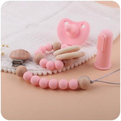 China Silicone Toothbrush Infant Teething Toys 4 Pieces Set Baby Pacifier Clips Teether à venda