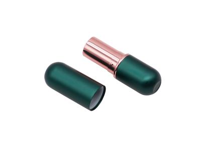 China Tubos vacíos cosméticos magnéticos verdes de lujo del protector labial 3.8g en venta