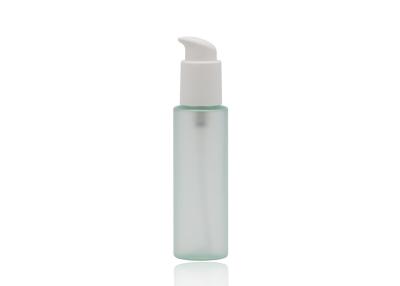 China 100ml Glass Cosmetic Pump Bottle Flat Shoulder Clear Green Color for sale